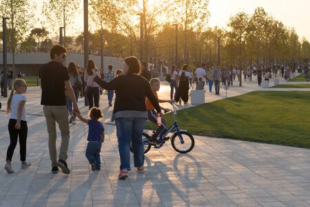 Krasnodar. Russia. Park Galitsky. 08 2017. People at the opening of a modern leisure Park before sunset.のeditorial素材