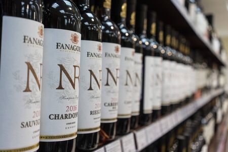 background with a lot of wine bottles Fanagoria on the shop window.のeditorial素材