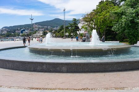 Yalta, Crimea-may 30, 2018: fountain on the waterfront with walking peopleのeditorial素材