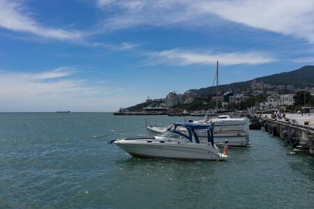 Yalta, Crimea-may 30, 2018: Seaport city with white boats at the pier.のeditorial素材