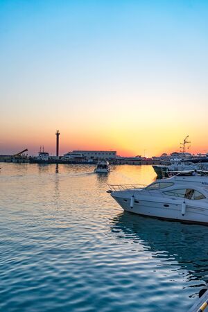 Sochi, Russia-June 14, 2018: Sea port with boats and ships at sunset.のeditorial素材
