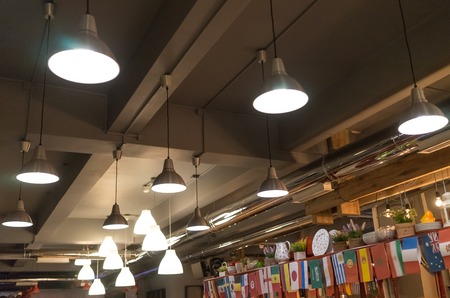 Sochi, Russia-June 14, 2018: Lighting in the cafe and small flags of different countries in the interior.のeditorial素材