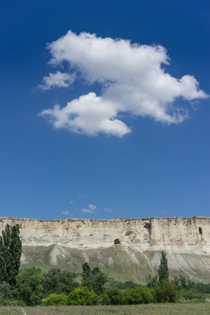 Landscape overlooking the white rock in the Crimea, against the blue sky with clouds.の写真素材