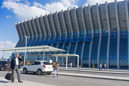 Simferopol, Crimea-may 22, 2018: People and cars at the entrance to the modern airport building.のeditorial素材