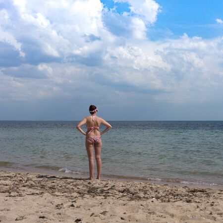 Evpatoria, Crimea-may 23, 2018: The coastline of the city with yellow sand and resting people.のeditorial素材