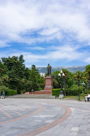 Yalta, Crimea-may 30, 2018: Lenin monument in the city square surrounded by trees.のeditorial素材
