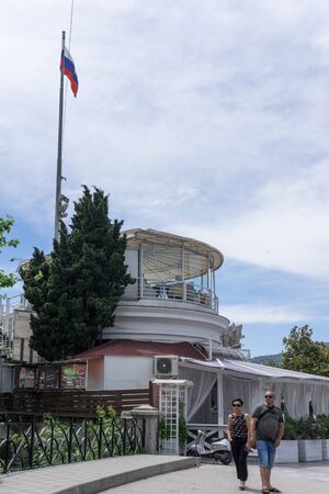 Yalta, Crimea-may 30, 2018: The building of the cafeteria on the waterfront under the Russian flag.のeditorial素材
