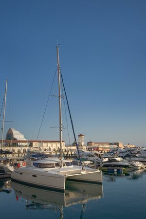 Sochi, Russia-June 14, 2018: vertical sea view with beautiful white catamaran in the portのeditorial素材