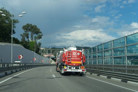 Sochi, Russia-June 19, 2018: Big tanker truck with a red tank going on the roadのeditorial素材