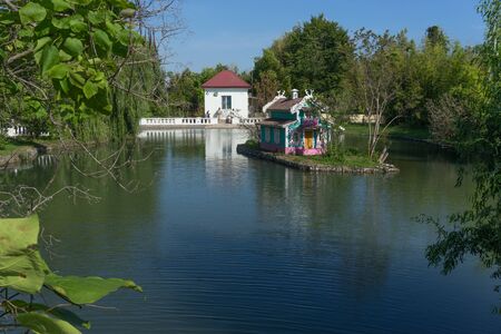 Sochi, Russia-June 24, 2018: a beautiful pond with birds and fish and a house for birdsのeditorial素材