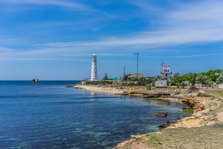 Tarkhankut, Crimea-may 25, 2018: Sea landscape with a view of the white lighthouseのeditorial素材