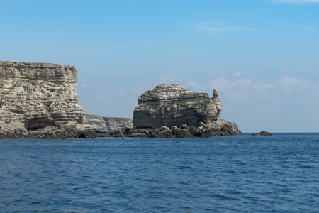 Crimean landmark: Cape Tarkhankut with beautiful rocks on the background of the sea and sky.の写真素材