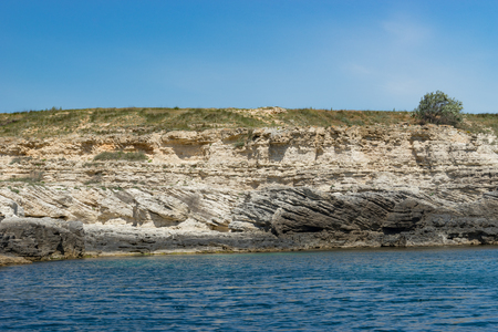 Crimean landmark: Cape Tarkhankut with beautiful rocks on the background of the sea and sky.の写真素材