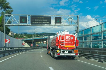 Sochi, Russia-June 19, 2018: Big red car with fuel going on the roadのeditorial素材