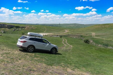 Simferopol, Crimea-may 22 2018: A big white SUV on nature background on a Sunny day.のeditorial素材