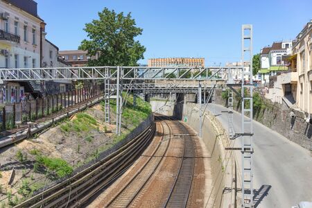 Vladivostok, Russia-July 28, 2018: Urban landscape with railway tracks in the middle of buildings.のeditorial素材