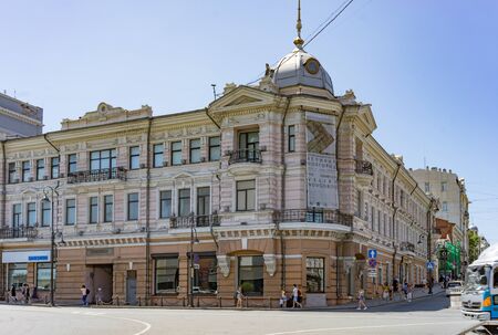 Vladivostok, Russia-July 28, 2018: Urban landscape with an old building against a blue sky.のeditorial素材
