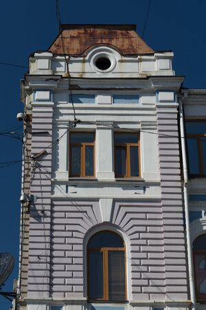 Vladivostok, Russia-July 28, 2018: Urban landscape with an old building against a blue sky.のeditorial素材
