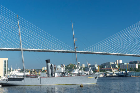 Vladivostok, Russia-July 28, 2018: warship on the background of a Golden bridge and blue sky.