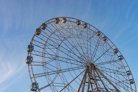 Sochi, Russia-January 7, 2018: big Ferris wheel in bronze color on the blue sky background.のeditorial素材