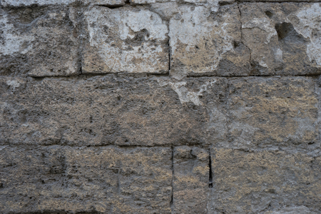 Old brick wall of loose shell rock. For network and designの写真素材