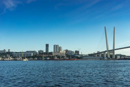 Vladivostok, Russia-August 11, 2018: Urban landscape with views of the Golden bridge in the evening.のeditorial素材