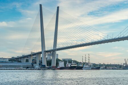 Vladivostok, Russia-August 11, 2018: Urban landscape with views of the Golden bridge in the evening.のeditorial素材