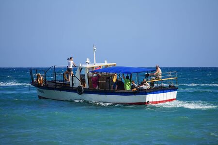 Koktebel, Crimea-June 27, 2015: Boat trip on the blue sea on a warm summer day.のeditorial素材