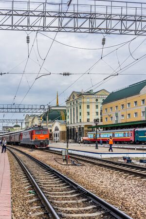 Ulan-Ude, Russia - July 17, 2018: Railway station of the city with the road, trains and people.のeditorial素材