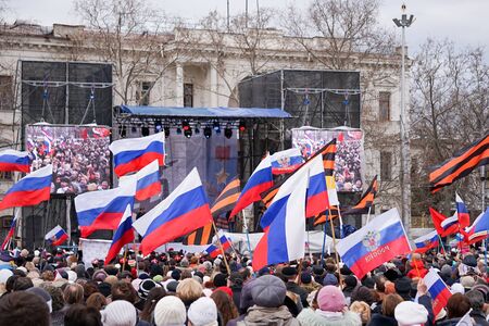 Sevastopol, Crimea-March 18, 2015: Russian Patriotic holiday with flags and concerts in the city square.のeditorial素材