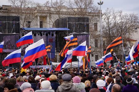 Sevastopol, Crimea-March 18, 2015: Russian Patriotic holiday with flags and concerts in the city square.のeditorial素材