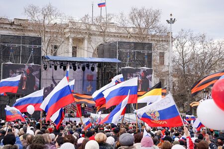 Sevastopol, Crimea-March 18, 2015: Russian Patriotic holiday with flags and concerts in the city square.のeditorial素材