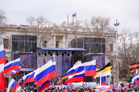 Sevastopol, Crimea-March 18, 2015: Russian Patriotic holiday with flags and concerts in the city square.のeditorial素材