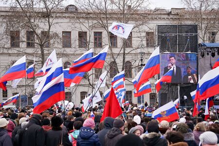 Sevastopol, Crimea-March 18, 2015: Russian Patriotic holiday with flags and concerts in the city square.のeditorial素材