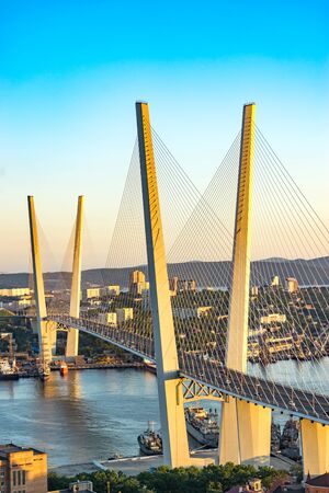 Vladivostok, Russia-September 27 2018: Urban landscape with views of the Golden bridge in the evening.のeditorial素材
