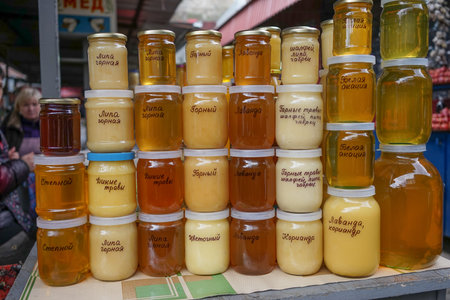 Yalta, Crimea: Production of the Yalta market, honey of different color in banks on a counter for sale.の写真素材