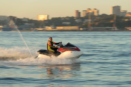 Vladivostok, Russia-September 16, 2018: A man in a waterproof suit riding on a sea jet ski.のeditorial素材