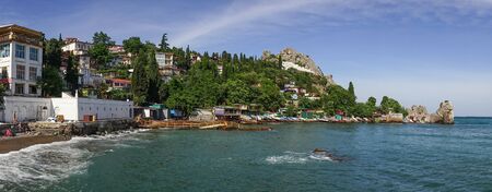 Gurzuf, Crimea-may 29, 2018: panorama of the sea landscape of Gurzuf coastline with beach and architecture.のeditorial素材