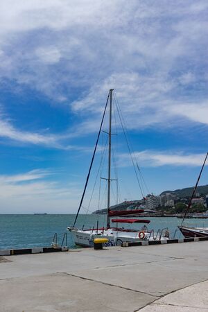 Yalta, Crimea-may 30, 2018: seascape with a boat on the background of the sea.のeditorial素材