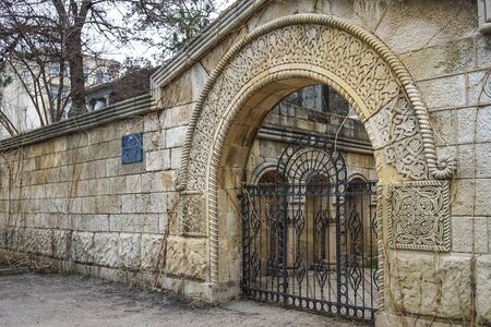 Feodosia, Crimea-March 20, 2015: Urban landscape with an ancient stone wall with ornaments.のeditorial素材