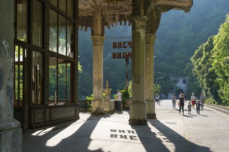 New Athos, Abkhazia-April 29, 2018: Destroyed station "Psyrtskha" with people.のeditorial素材