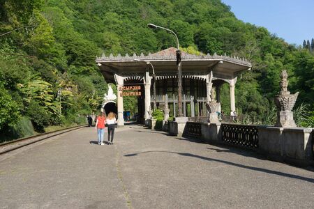 New Athos, Abkhazia-April 29, 2018: Destroyed station "Psyrtskha" with people.のeditorial素材