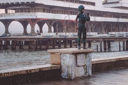 Sukhumi, Abkhazia-January 14, 2015: Marine landscape with views of the statue of the Cheeky boy with chicken.のeditorial素材