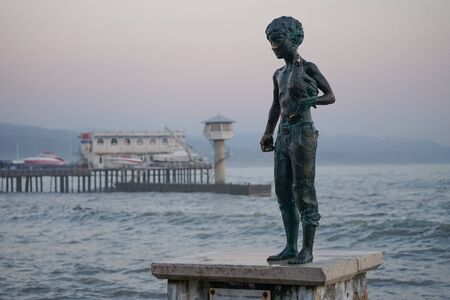 Sukhumi, Abkhazia-January 14, 2015: Marine landscape with views of the statue of the Cheeky boy with chicken.のeditorial素材
