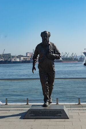Vladivostok, Russia-July 28, 2018: urban landscape with a monument to Solzhenitsyn on the background of the sea.のeditorial素材