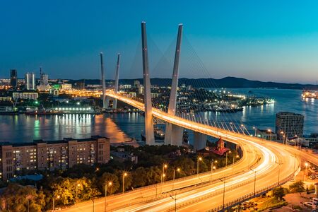 Vladivostok, Russia-September 9, 2018: Urban landscape with views of the Golden bridge in the evening.のeditorial素材