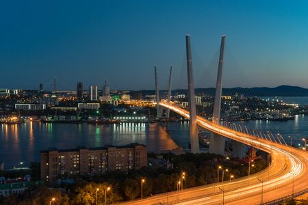 Vladivostok, Russia-September 9, 2018: Urban landscape with views of the Golden bridge in the evening.のeditorial素材