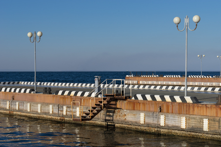 Vladivostok, Russia-December 1, 2018: Seascape with pier and beautiful lanterns in the sky.の写真素材