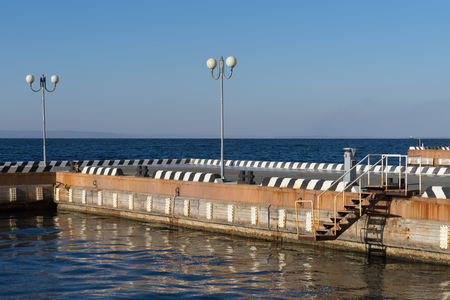 Vladivostok, Russia-December 1, 2018: Seascape with pier and beautiful lanterns in the sky.の写真素材