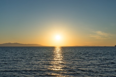 Seascape with beautiful sunset and sunset on the horizon.の写真素材